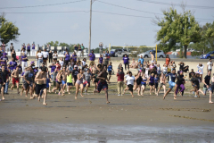 20 - August - Students plunge into the Long Island Sound in Seaside Park creating a new UB tradition